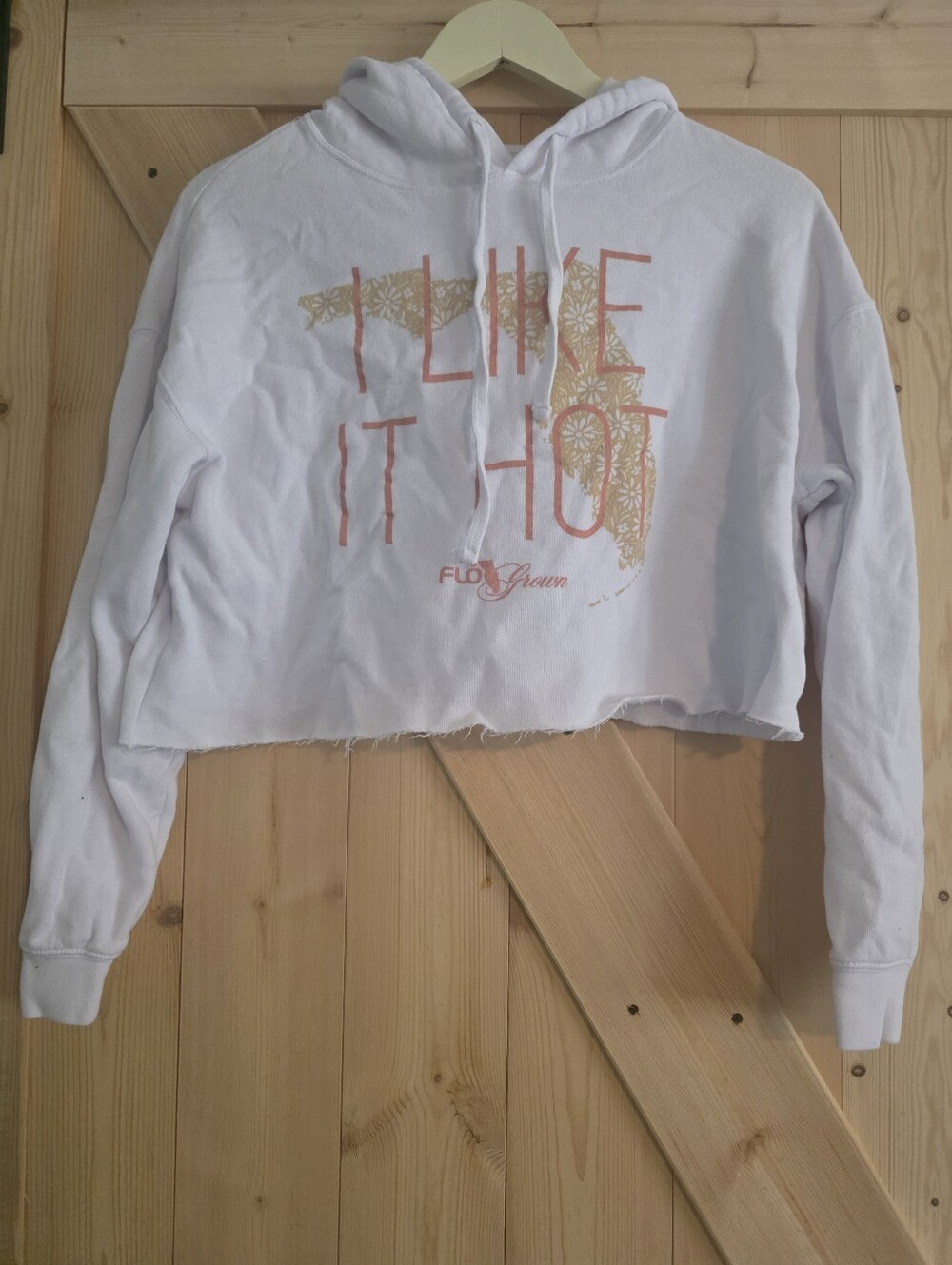 White Graphic Hoodie with Coral Text and Gold Floral Print